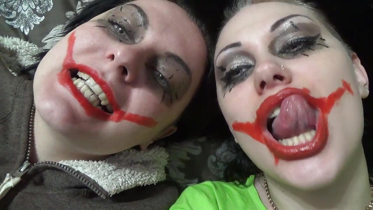 Two crazy clown girls dangle you above their hungry mouths before fighting over who will eat you alive