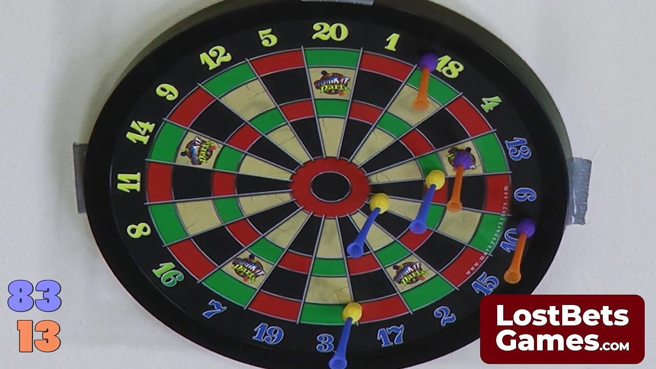 Sexy lesbian players pair up for a strip darts game