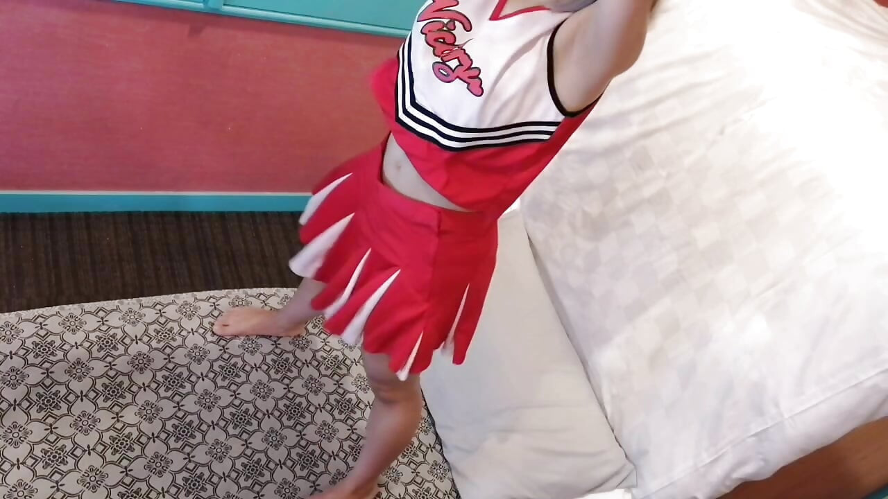 A cute, busty married woman performs exercise 4 in an erotic cheerleader costume. Peeking down from above. Home made amateur Private Shoot