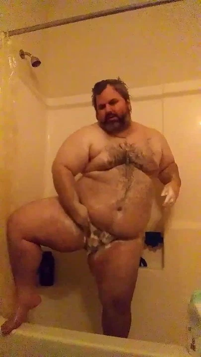 Chubby man in the shower