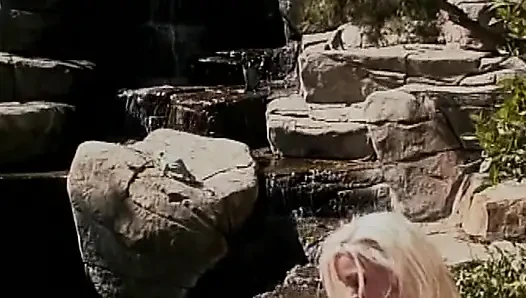 Strapon loving lesbians having fun by the pool