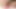 Small and petite Keira Verga wearing a sexy fishnet bodystocking on the bed with her small tits and her big trans girl cock