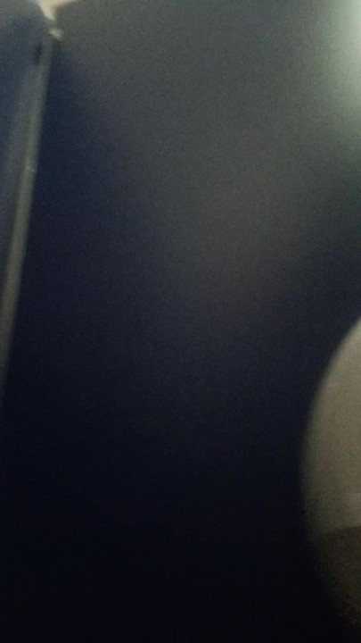 Showing her buttocks in a public bathroom
