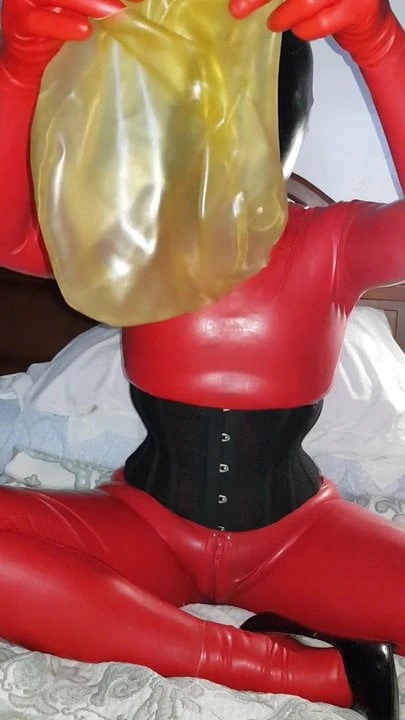 Today enjoy my catsuit, breathplay hood, corset and heels