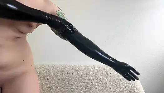 Hot Domme Redhead Teases in Latex Opera Gloves and Thigh High Boots