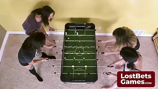 Breasts were quickly exposed in a playful strip foosball game