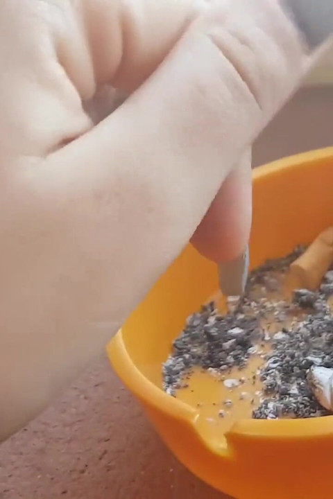 Tempting Italian girl smokes a cigar in a close up video