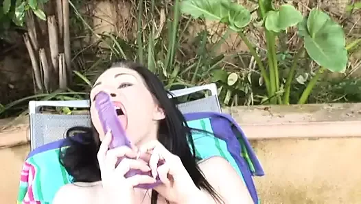 Horny babe fucks her huge pussy with a big purple dildo