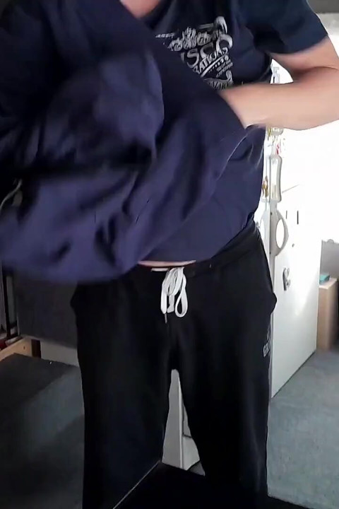 John is peeing on his own sweatshirt