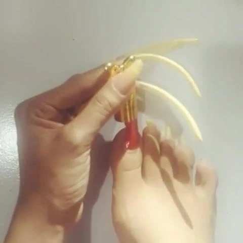 Kheora Seong paint her long toenails