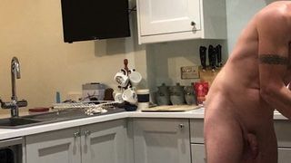 Nudist in kitchen