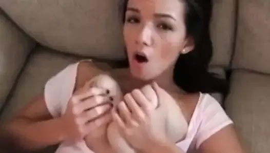 She has a shaven pussy and incredibly big tits.