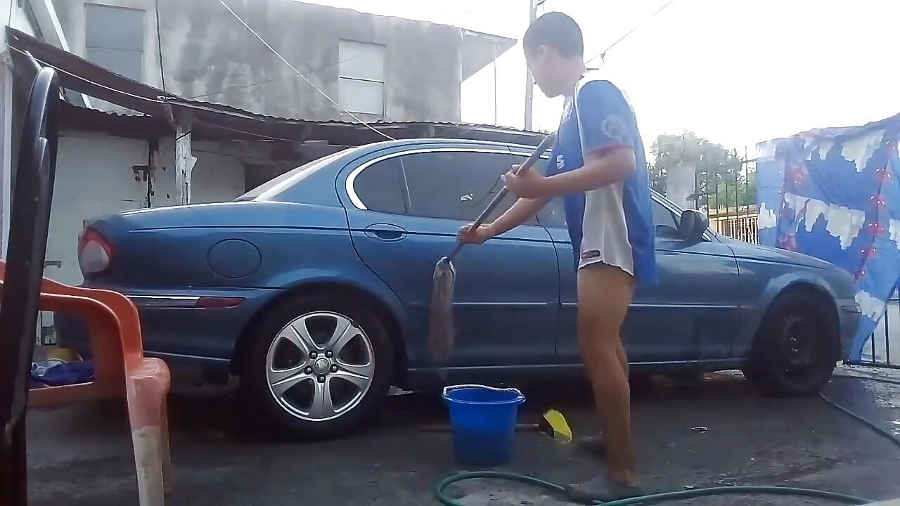 Jesus in gray boxer washing his jaguar car