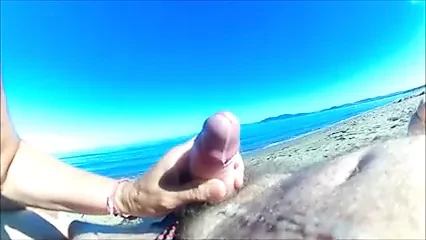 Granny masturbating stranger on the beach.