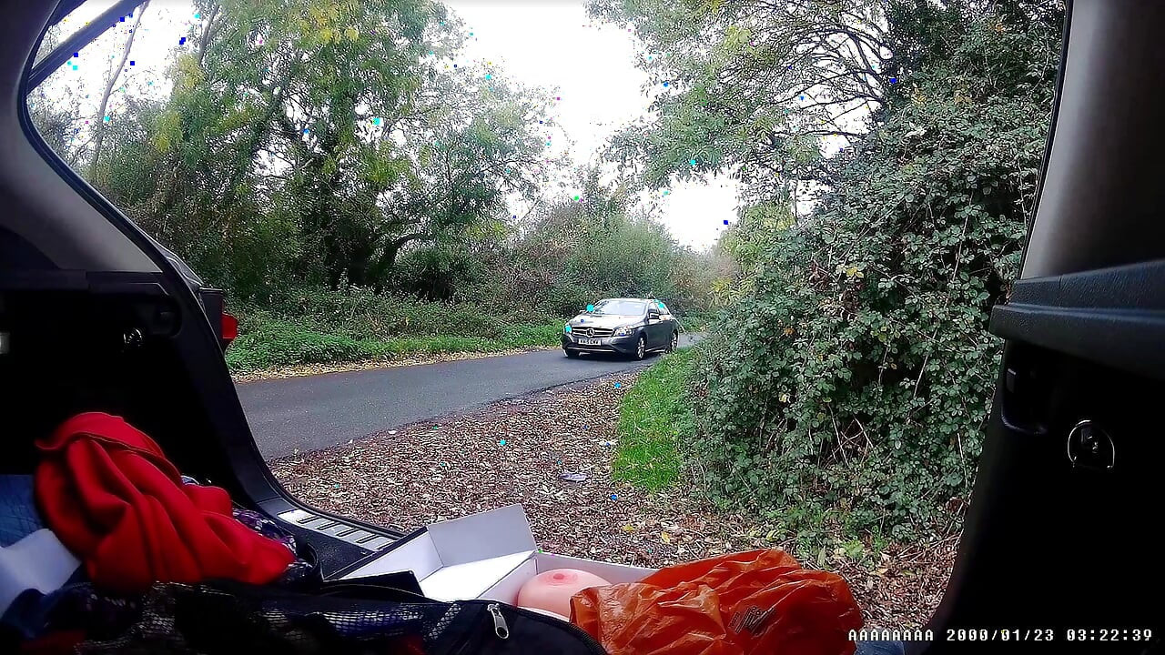 Just getting changed parked at side of road with cars driving past
