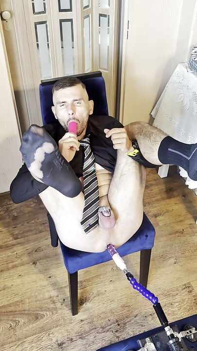Businessman Gets Fucked by a Sex Machine and Cums in a Chastity Cage