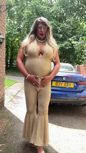 Emotional moment from "Sexy Crossdresser kellycd2022 in gold stretchy catsuit and heels"