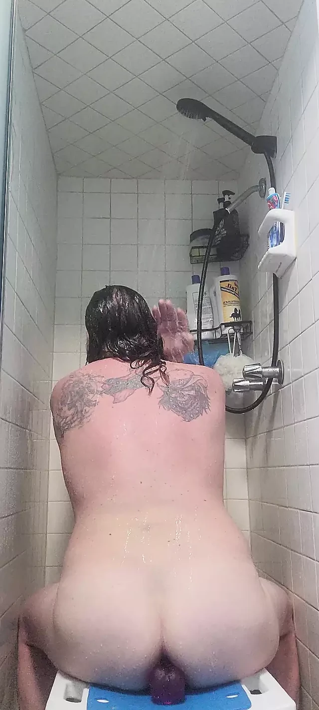 Chubby white guy Neil sucks and fucks dildo in the shower