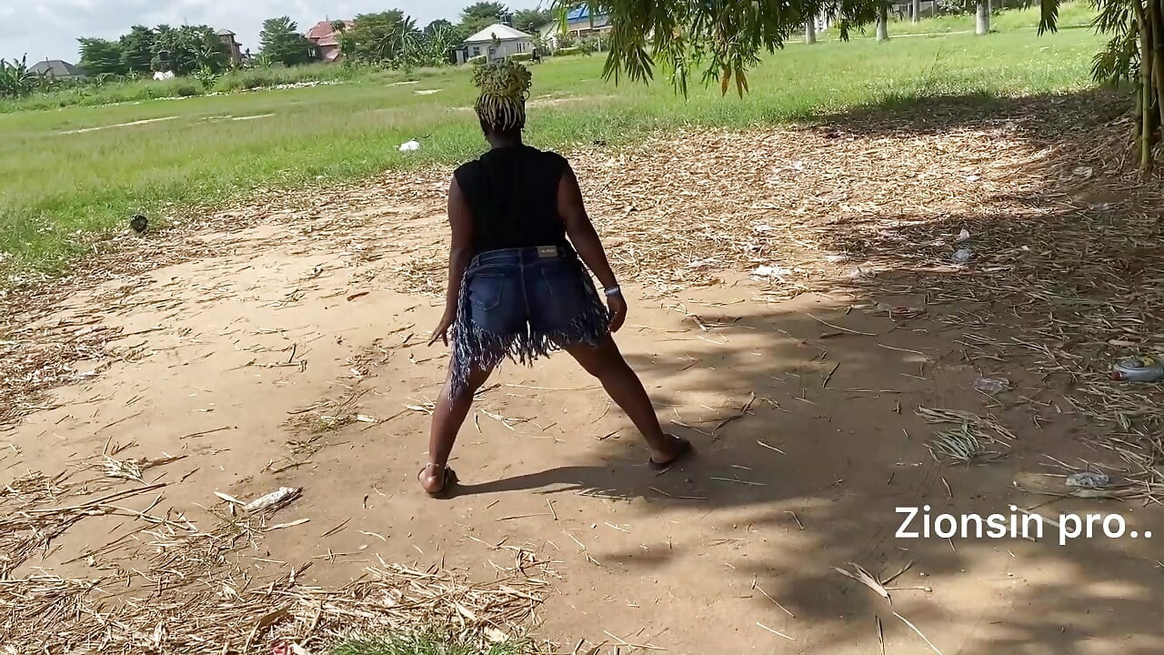 Ebony sexy black girl dances in outdoor with much laughter