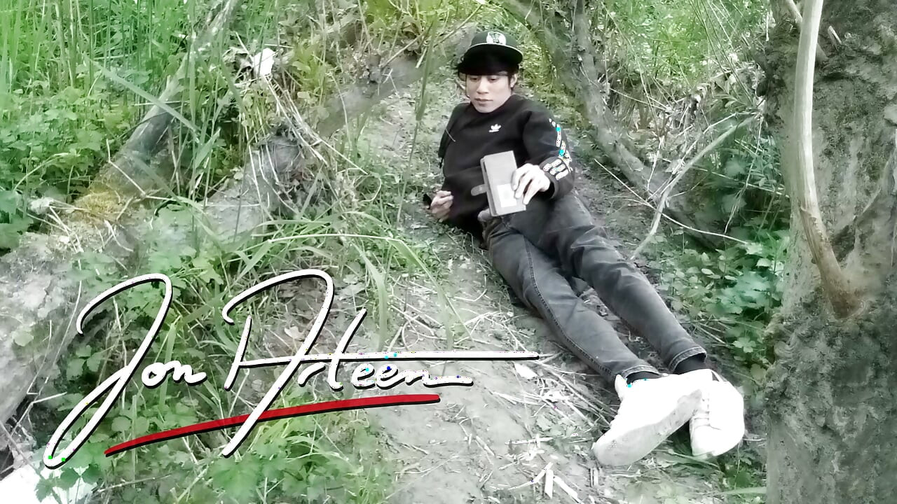 Cute Jon Arteen Gay twink jerks off outdoors, dry-humps the air, and shoots cum through a hole in his pants