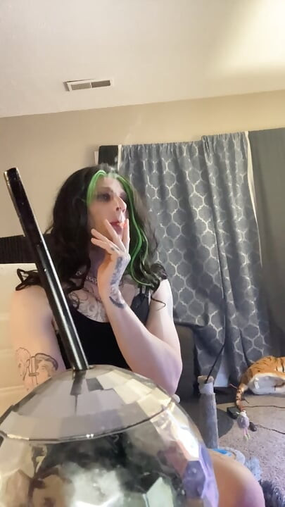 Sexy crossdresser smokes