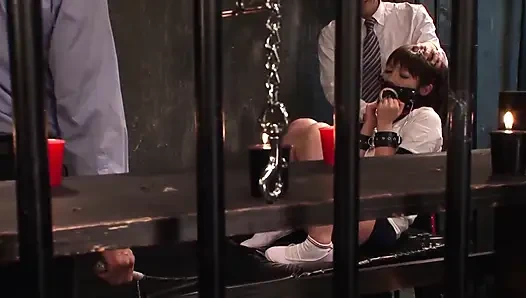 Threeway BDSM session with a tied up slut in prison