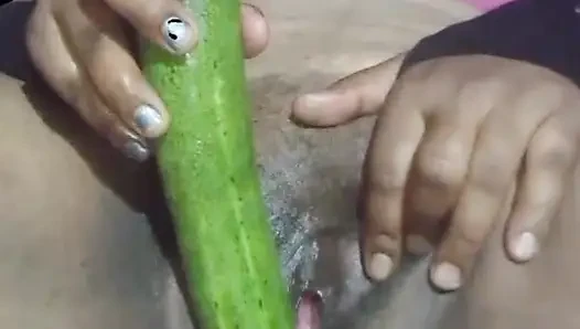 Today, Indian bhabhi quenched her desire by inserting a cucumber into her pussy.