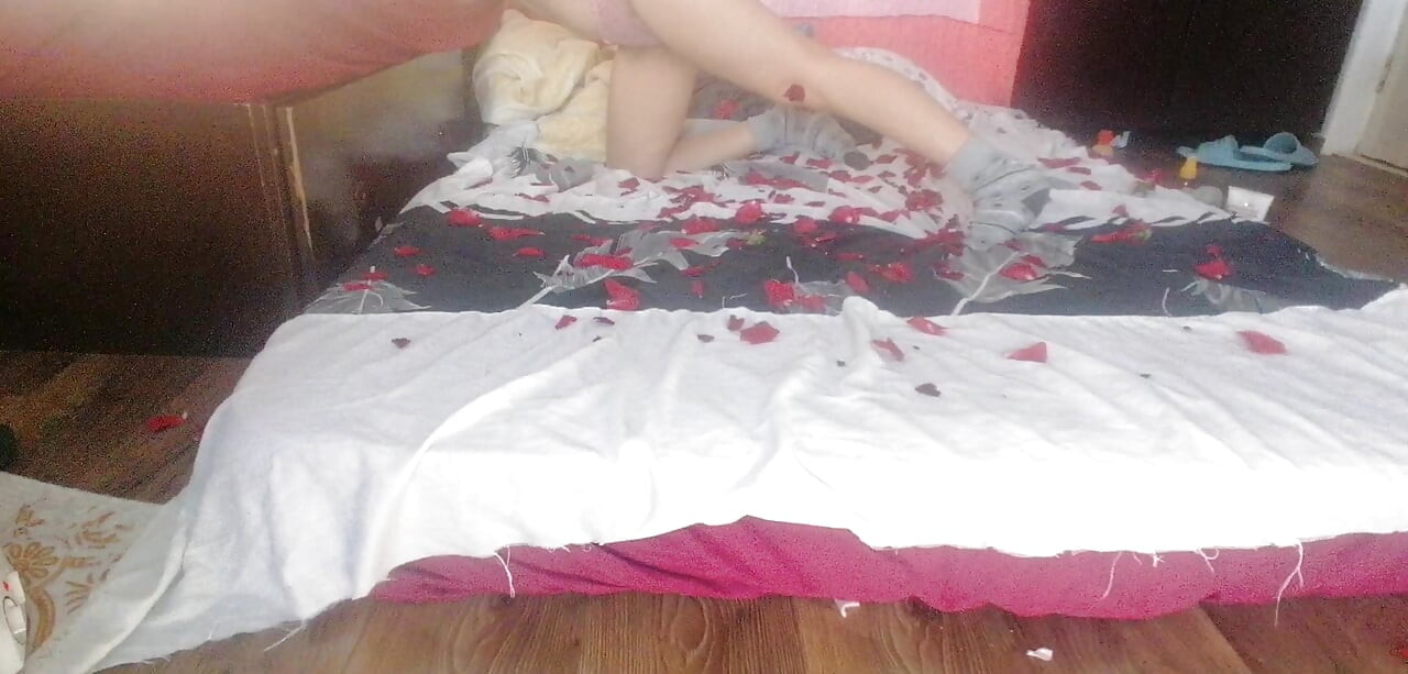 Sensual massage of a hot couple with oil on the body. Foreplay in the bedroom with an amateur couple.