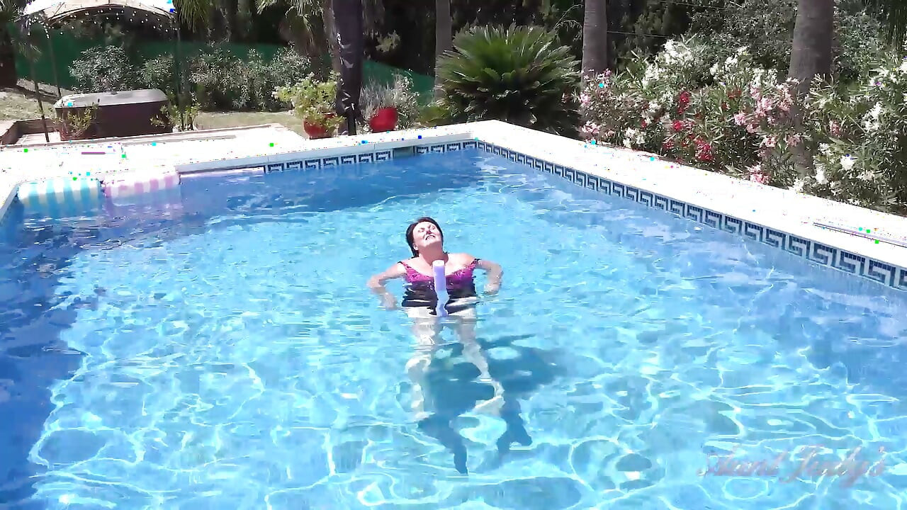 Busty Redhead MILF JoJo Robinson Goes Skinny Dipping in the Pool