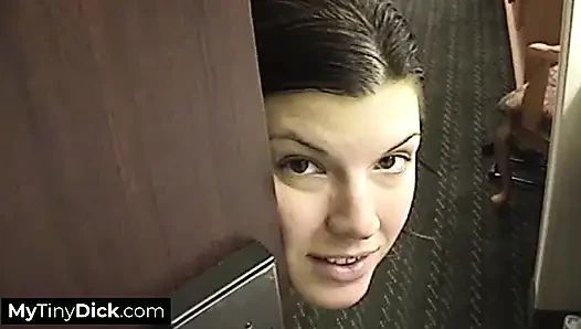 A beautiful brunette hard at work sucking his small cock