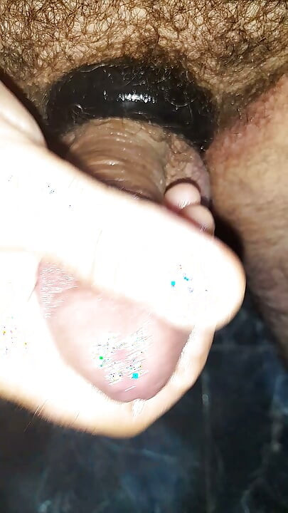 Handjob with lube and cock and balls sex ring with a huge plug inside my ass in close-up