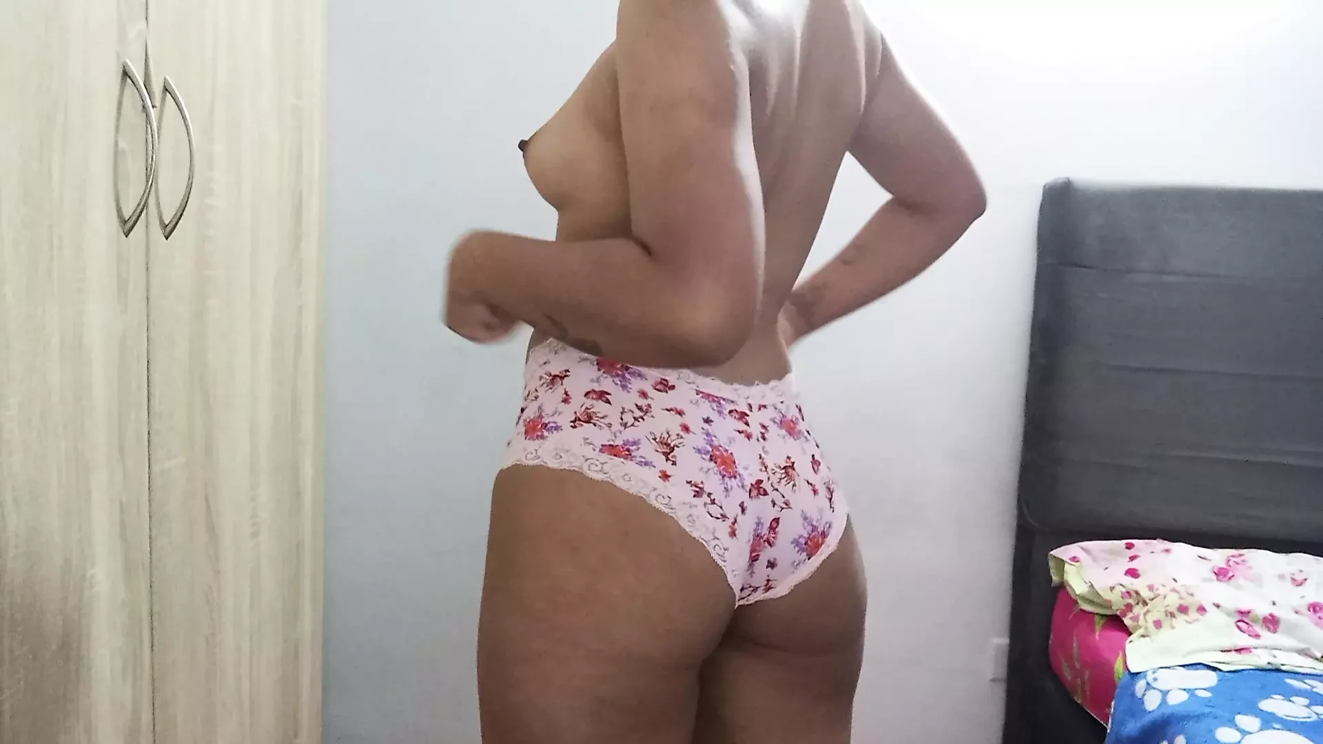 Erotic dance of an 18-year-old girl in her pink panties