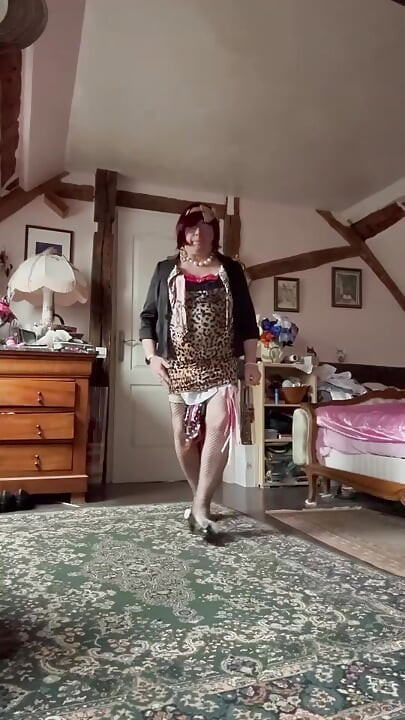 Dressed in a little short leopard dress for an evening