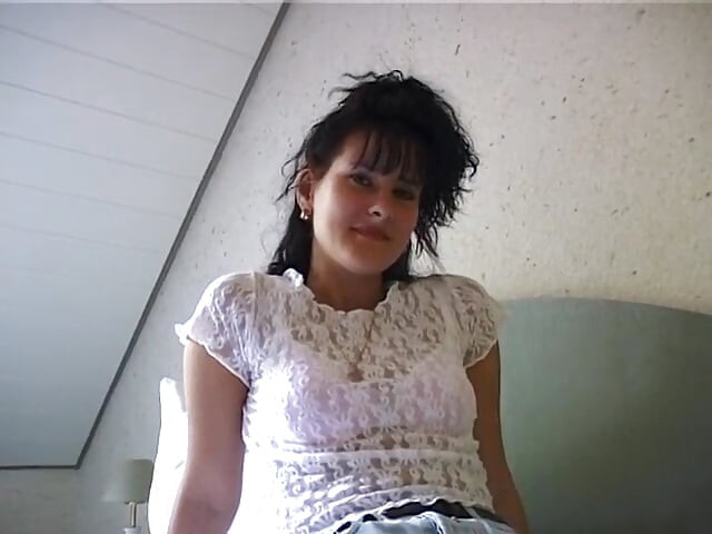 Horny girl lays in bed finger fucking herself and stroking clit