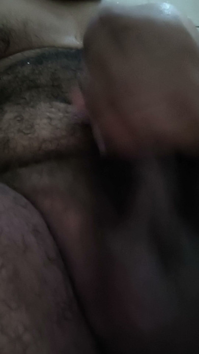 Hairy man pulling out his milk