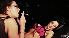 Cigarette smoking busty lesbos sensually caress each other and have a make out session