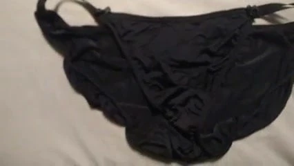 Huge load on her silk black panties