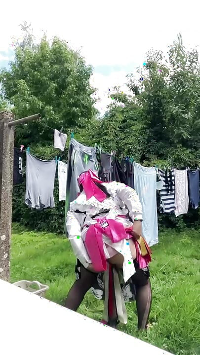 In gardening outfit to hang the laundry