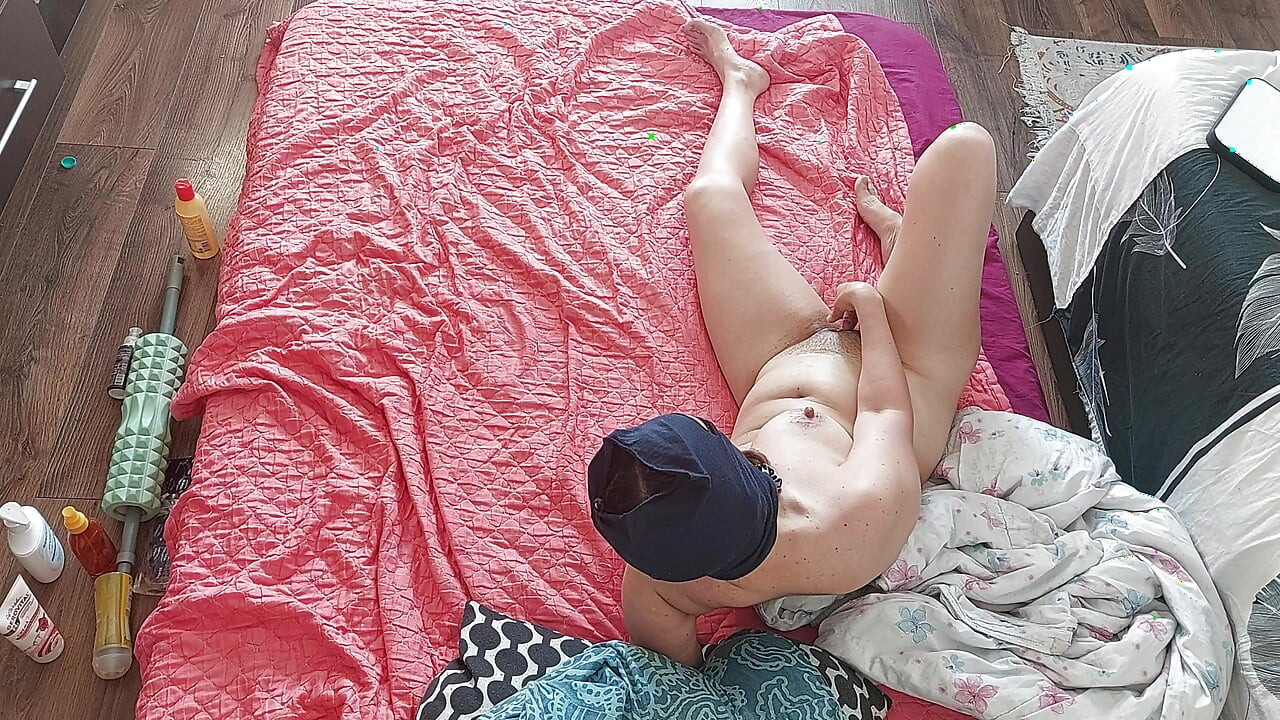 Sensual massage of a sexy couple with oil on the body. Foreplay in the bedroom with an amateur couple.