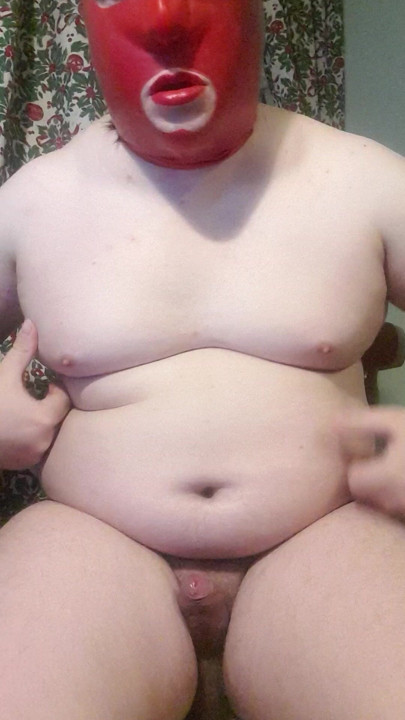 Chubby sissy in latexhood and red lipstick