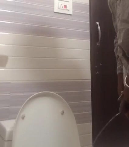 Urinating and shaking penis
