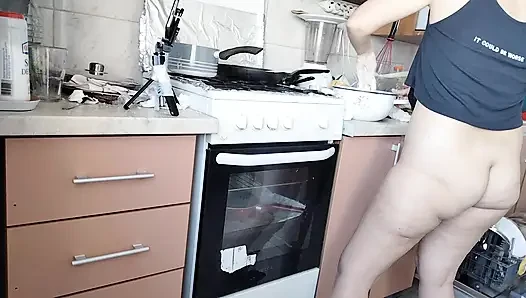 Sexy wife prepares lunch naked in the kitchen.