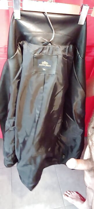 Ejaculating on the lining of her black leather coat