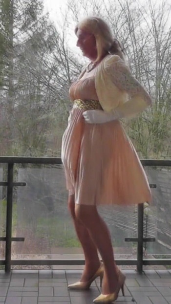 Memorable moment from "Wanking On A Winday Day In My Shiny Pleated Satin Gown"