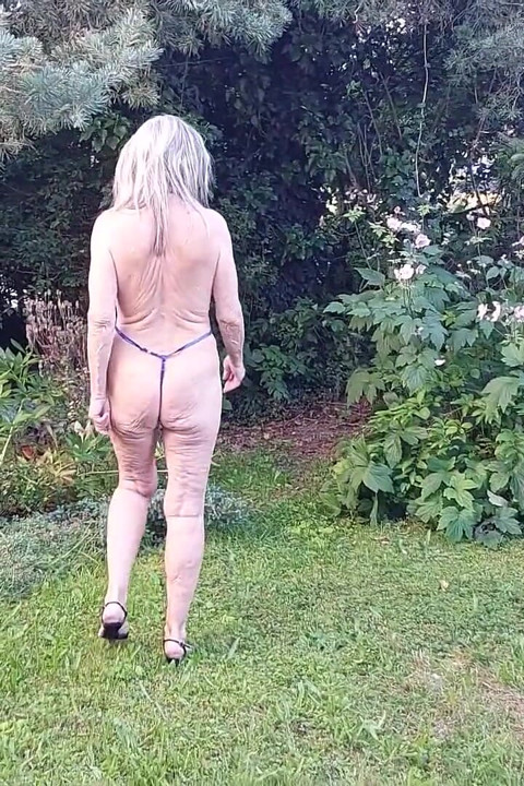 Watch 77 Years Old Martina Alsmost Naked in Her Garden