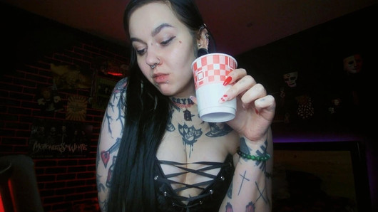 Alternative brunette drinking sparkling water and burping