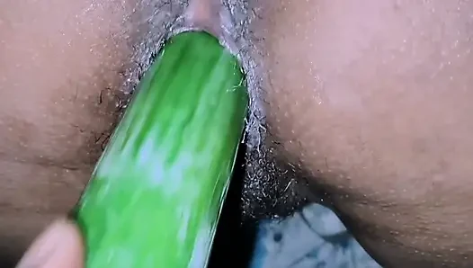 Pooja put his hand in his wife's pussy and inserted cucumber hot.