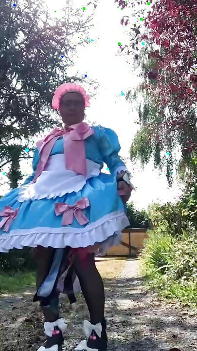 In a blue maid outfit with pink bows for a day