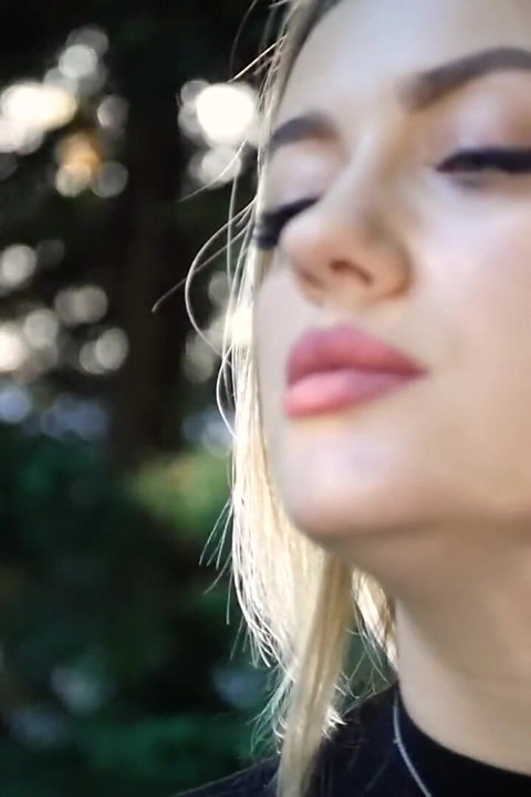 Hot Blonde Babe Smoking Two Black Cigarettes in Nature