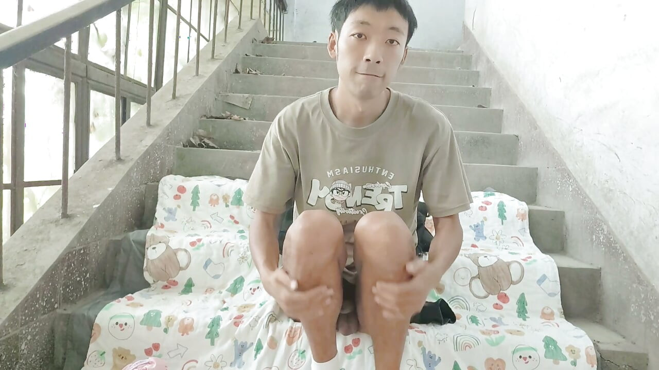 Cute Asian boy enjoys a wonderful time by ejaculating and consuming semen in the ruined stairwell on the eve of his birthday